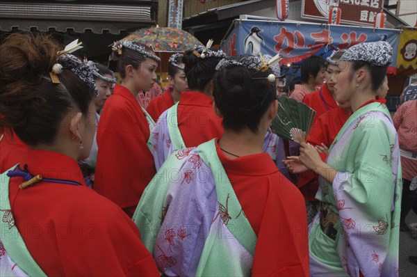 JAPAN, Chiba, Narita, Women aged 20-30 years old in traditional Edo-era costumes get instructions before pulling their neighborhood dashi or wagon during the Gion Matsuri