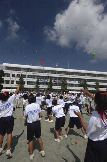 JAPAN, Chiba, Tako , Tako Junior High School Sports Day with 12-15 year old students and a few parents trying to throw bean bags into basket