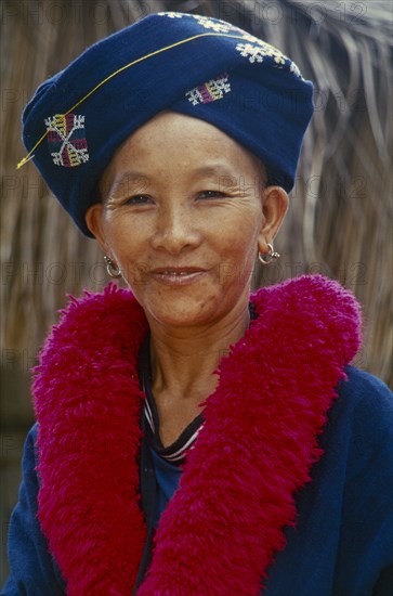 THAILAND, Chiang Rai, Mae Chan District. Portrait of a Iu Mien woman in traditional attire at her Village Baan Lao Shi Kuay