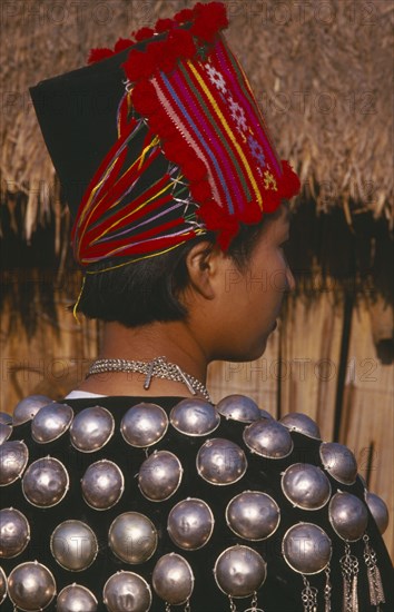 THAILAND, Chiang Mai Province, Muang Nga, Back view of a Jinghpaw woman in traditional jacket and hat