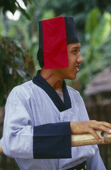 MYANMAR, Kachin State, Manhkring, Portrait of a Lisu man with Mahkhong marks on his neck in traditional Lisu attire of the Putao area