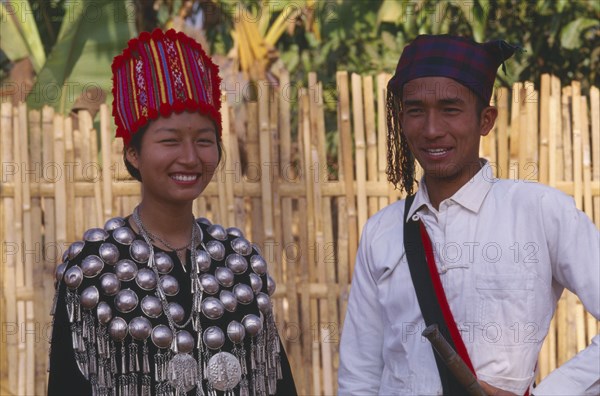 THAILAND, Chinag Mai Province, Muang Nga, Young Jinghpaw man and woman in traditional attire