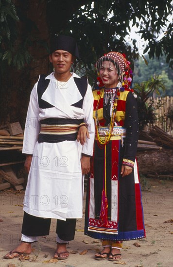 MYANMAR, Kachin State, Manhkring, Lisu man and woman in traditional Lisu attire of the Myitkyina area