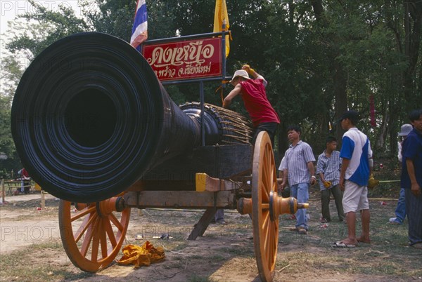 THAILAND, Chiang Mai, Cannon drum competition with drummer beating drum