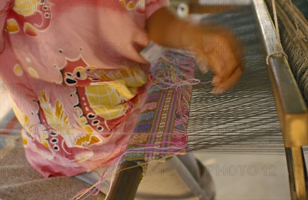 THAILAND, Chiang Mai Province, Mae Ai District, Silk weaving at the weavers group in Bahn Mai Mawk Jahm