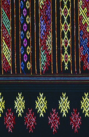 MYANMAR, Kachin State, Myitkyina, Close up detail of a Lacid womans sarong which is traditional Kachin attire