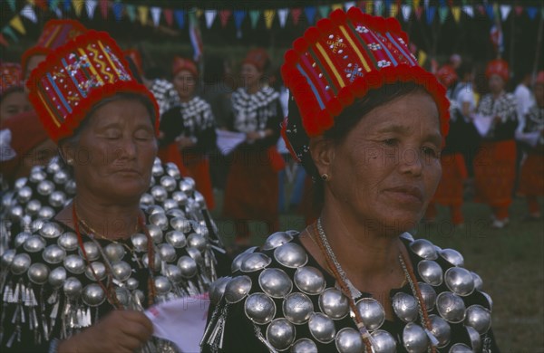 THAILAND, Chiang Mai, Samathi Mai, Kachin Manou Dance. Jinghpaw women in traditional costume during the dance