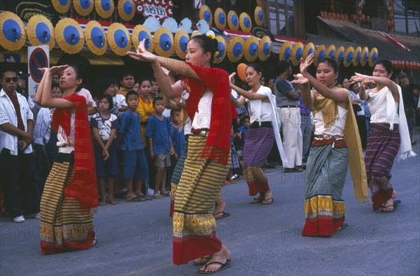 THAILAND, Chiang Mai, Baw Sang, Dancers in traditional northern Thai attire performing traditional Thai dance at the Umbrella Festival