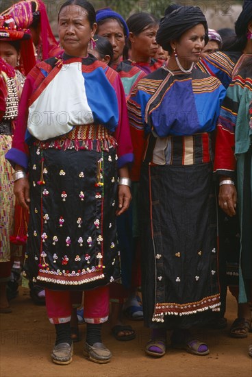 THAILAND, Chiang Rai Province, Huai Khrai, Lisu women wearing seldom worn aprons with silver ear chains for New Year