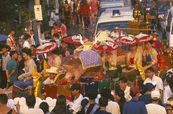 THAILAND, Chiang Mai, Songkran aka Thai New Year festival parade to Wat Phra Singh with floats depicting the years of the rat and ox