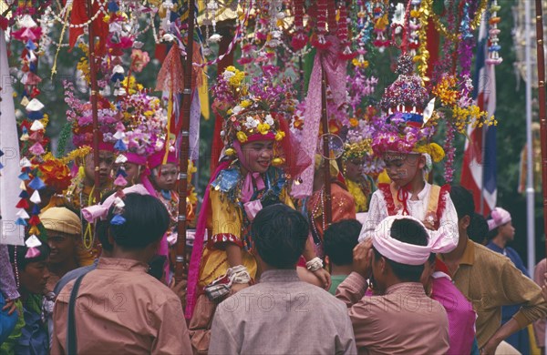 THAILAND, Chiang Mai, Shan Poi San Long. Crystal Children ceremony with Luk Kaeo in costumes sitting on mens shoulders at Wat Pa Pao