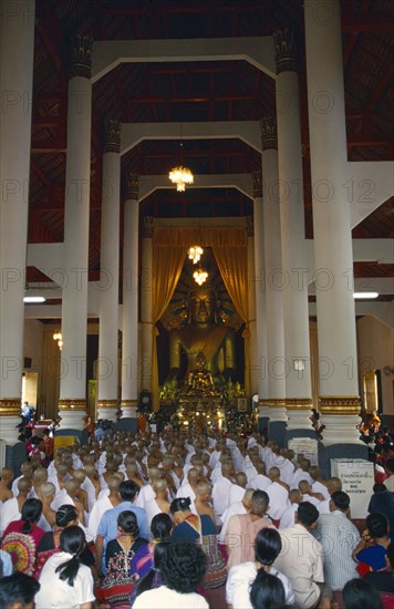 THAILAND, Chiang Mai, Hill tribe boys novice monk ordination candidates and families at the pre ordination ceremony at Wat Phra Singh