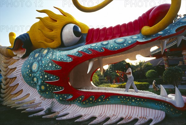 THAILAND, Chiang Mai, Kuan Yin Bodhisattva Centre. Large dragon statue that people can walk through