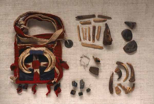 THAILAND, General, "Yao Shamans bag decorated with wild boar tusks and contents of wood, shells, antlers and opium etc."