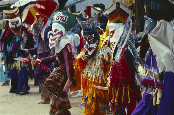 THAILAND, Loei Province, Dan Sai, Phi Ta Khon or Spirit Festival. Group of spirits in costumes and masks dancing