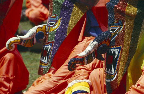 THAILAND, Loei Province, Dan Sai, Phi Ta Khon or Spirit Festival. People wearing brightly coloured spirit cotumes