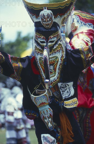 THAILAND, Loei Province, Dan Sai, Phi Ta Khon or Spirit Festival. Person wearing spirit mask