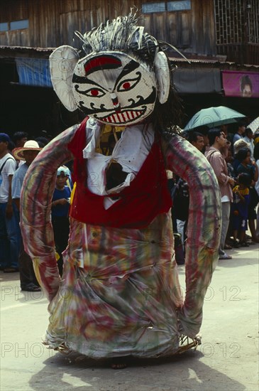 THAILAND, Loei Province, Dan Sai, Phi Ta Khon or Spirit Festival. Person wearing spirit costume during parade
