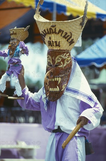 THAILAND, Loei Province, Dan Sai, Phi Ta Khon or Spirit Festival. Person wearing spirit costume