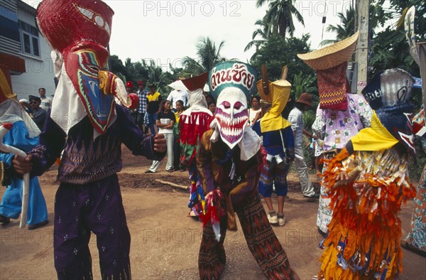 THAILAND, Loei Province, Dan Sai, Phi Ta Khon or Spirit Festival. People in spirit costumes during parade