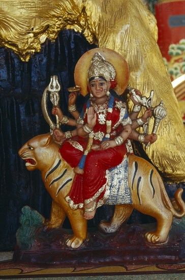 THAILAND, Chiang Mai Province, "Statue of Durga the inaccessible, a manifestation of Mahadevi emboding Shakti the female principle of the Hindu gods and her vehicle a tiger"