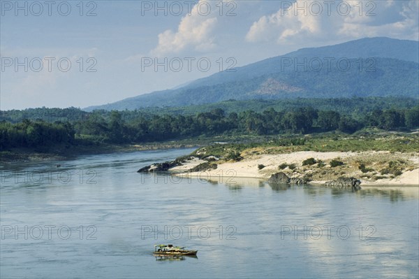 MYANMAR, Kachin State, Myitsung, View over the Upper Ayeyarwady River south of the confluence with small boat in the foreground