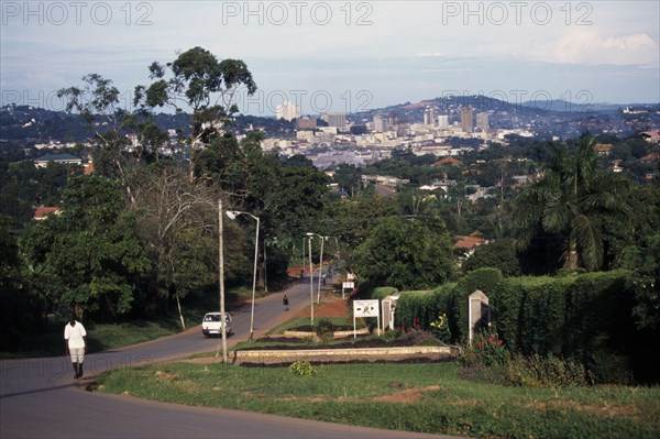 UGANDA, Kampala, Wealthy city suburbs with high rise city buildings beyond.