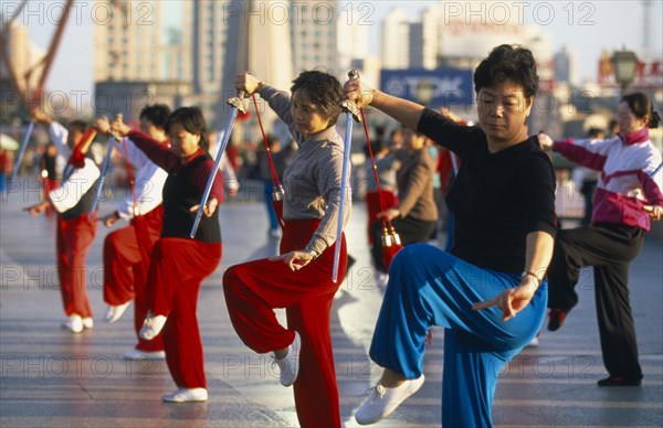 CHINA, Shanghai, Early morning group tai chi on the Bund.