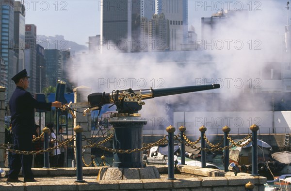 CHINA, Shanghai, Firing the Noon Day Gun on the Causeway Bay waterfront.