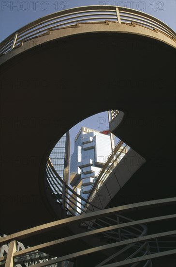 CHINA, Hong Kong, Steps to elevated walkway in the Central District framing view of the Lippo Centre.