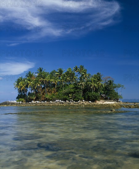 THAILAND, Phuket Province, General, Small islet covered in trees and vegetation near Nai Yang Beach.
