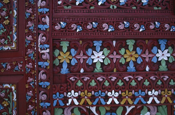 INDONESIA, West Sumatra, Architecture, Detail of highly decorated and carved door.