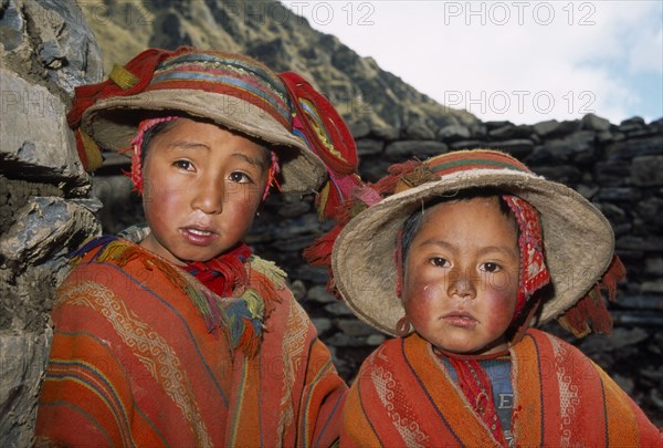 PERU, Andes, Cusco, Tastayoc Village.  Head and shoulders portrait of  Quechua Indian boys wearing traditional clothing.