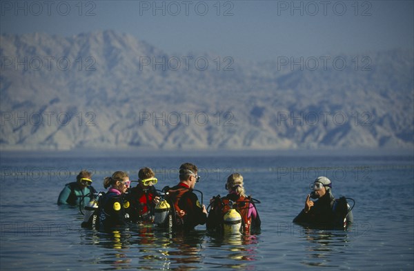 ISRAEL, Eilat, Coral Beach.  Diving class undergoing tuition at Red Sea resort.