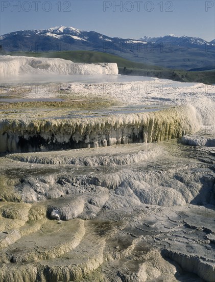 USA, Wyoming, Yellowstone National Park. Mammoth Hot Springs. View over white and yellow sulphur deposits forming waterfall effect