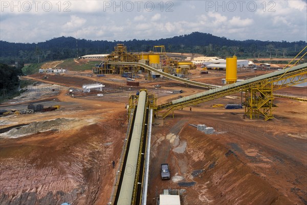 GHANA, Industry, Elevated view over gold mine and machinery.
