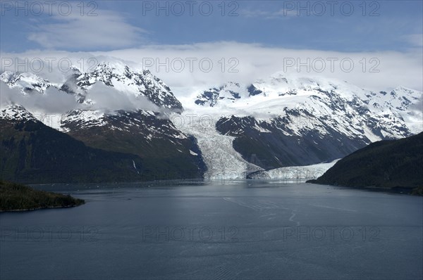 USA, Alaska, College Fjord, View over calm waters of the bay toward snow capped mountain range