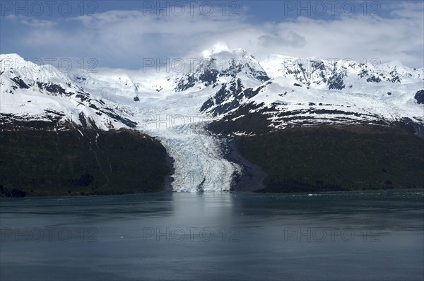 USA, Alaska, College Fjord, View over calm waters of the bay toward snow capped mountain range