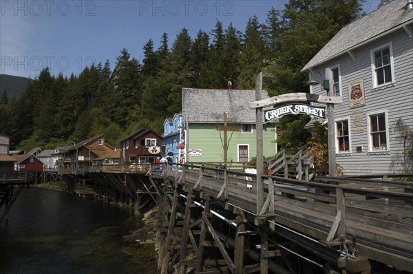 USA, Alaska, Ketchikan, View along Creek Street waterside houses and wooden walkway on propped up over the waters edge