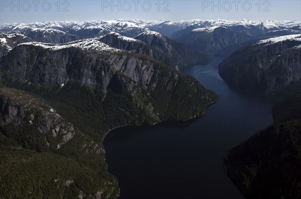 USA, Alaska, Misty Fjords Nat. Monument, Aerial view over river and surrounding rocky peaks