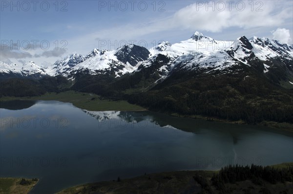 USA, Alaska, Prince William Sound, View over waters toward snow capped mountain peaks