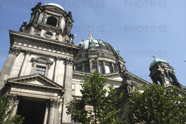 GERMANY, Berlin, Angled view looking up at the Berliner Dom with green copper domes