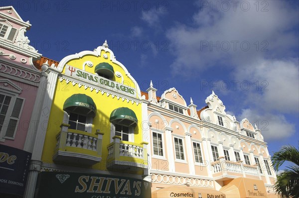 WEST INDIES, Dutch Antilles, Aruba, Oranjestad. Colourful colonial style facades of perfumerie and jewellery shops