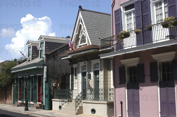 USA, Louisiana, New Orleans, French Quarter. View along row of pastel coloured houses