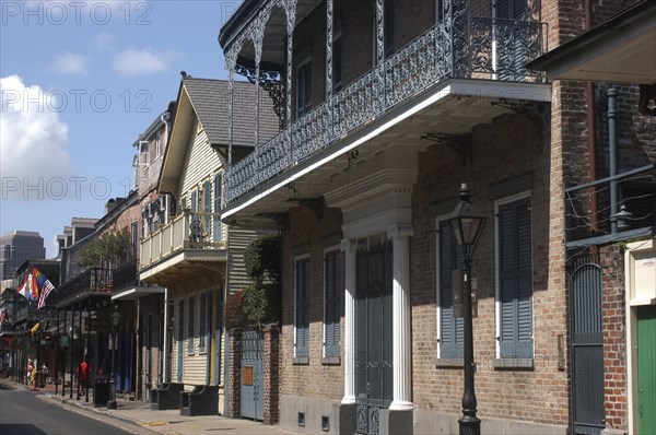 USA, Louisiana, New Orleans, French Quarter. View along buildings with ironwork balconies and shuttered windows