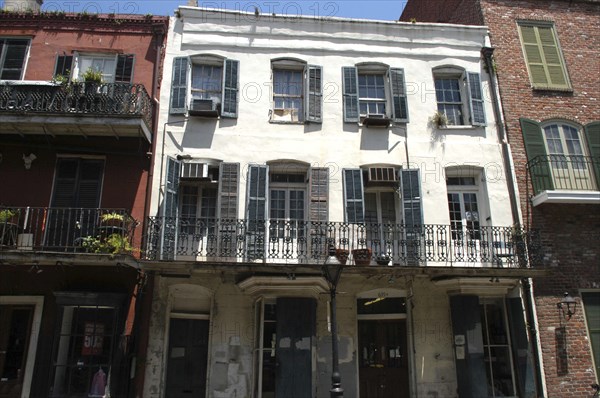 USA, Louisiana, New Orleans, French Quarter. Typical architecture with ironwork balconies and shuttered windows
