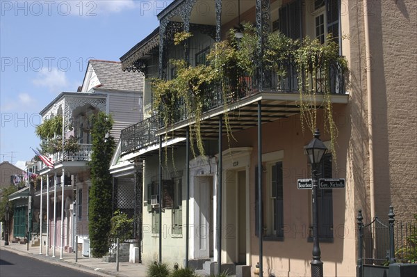 USA, Louisiana, New Orleans, French Quarter. Pastel coloured architecture with ironwork balconies