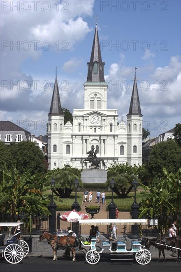 USA, Louisiana, New Orleans, French Quarter. St Louis Cathedral on Jackson Square with horse drawn carriages in the foreground