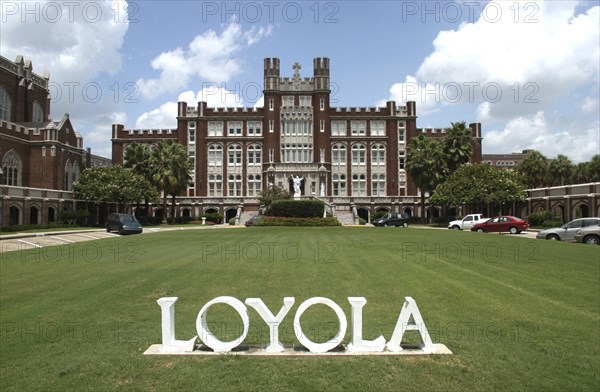 USA, Louisiana, New Orleans, Loyola University with word LOYOLA in white letters on the lawn in the foreground