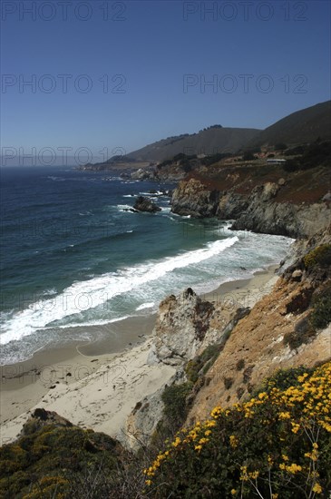 USA, California, Big Sur, Pacific Coast Highway. View over sandy bay and rocky coastline